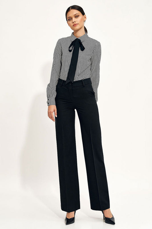 Front view of the Elegant Wide Leg Trousers by Nife, paired with a stylish checkered blouse, highlighting their sophisticated design and comfortable fit.