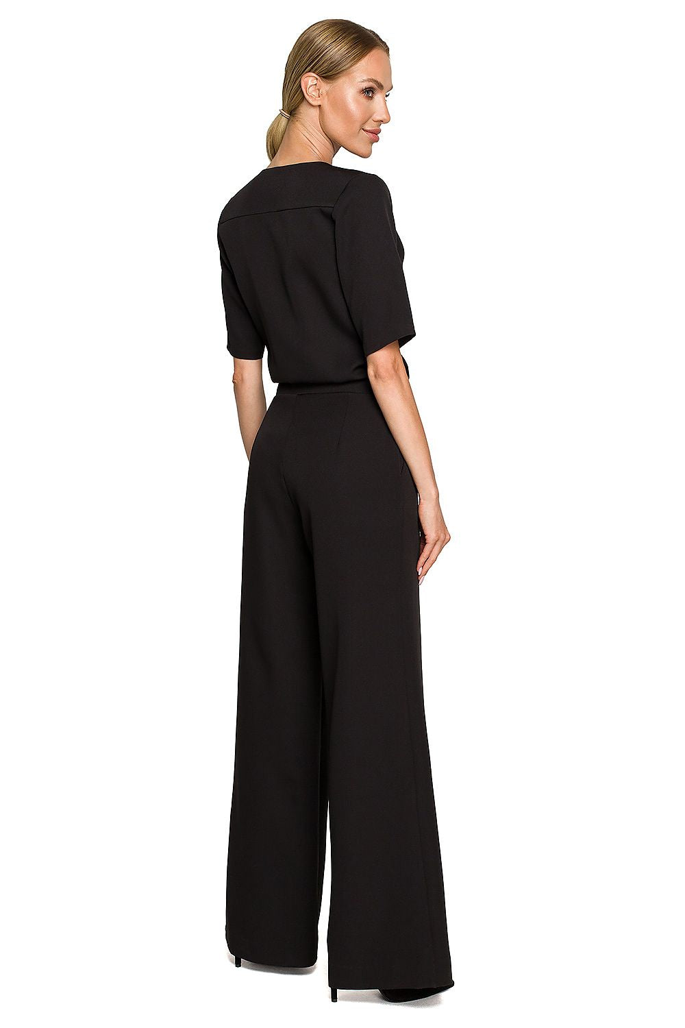 Elegant Wide Leg Trouser Suit with Elbow-Length Sleeves and Pockets - Designed by Moe, showcasing a model from the back in a refined black ensemble, highlighting sophisticated tailoring.