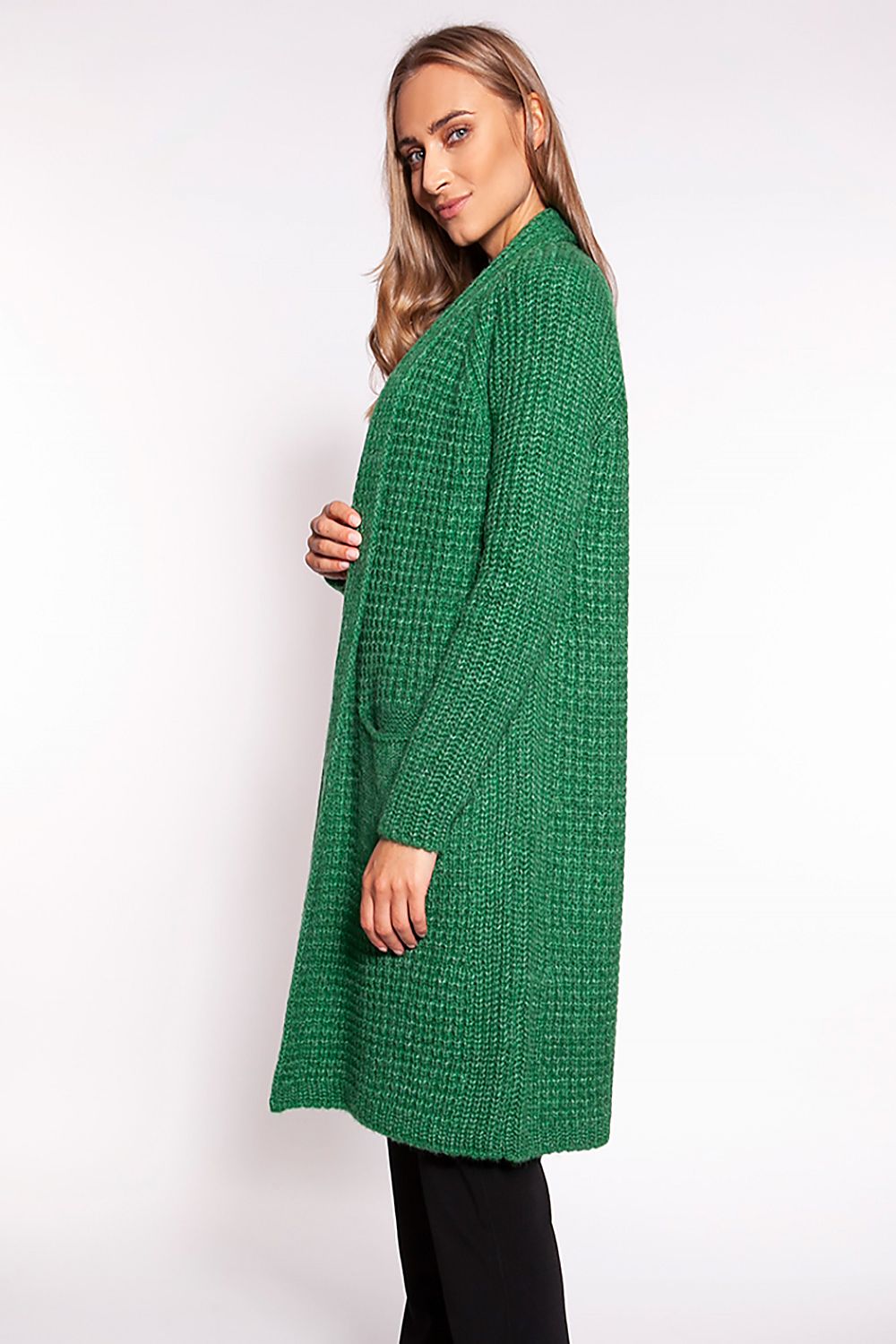 Elegant MKM Waffle Textured Cardigan with Shawl Collar and Practical Pockets - Knee-Length Design, showcased on a model in a rich green hue, emphasizing its luxurious texture and stylish silhouette.
