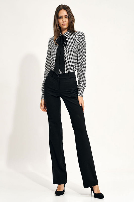 Model wearing the Elegant Long Sleeve Bow Shirt by Nife, paired with tailored black pants, displaying a chic office look with a fashionable print.