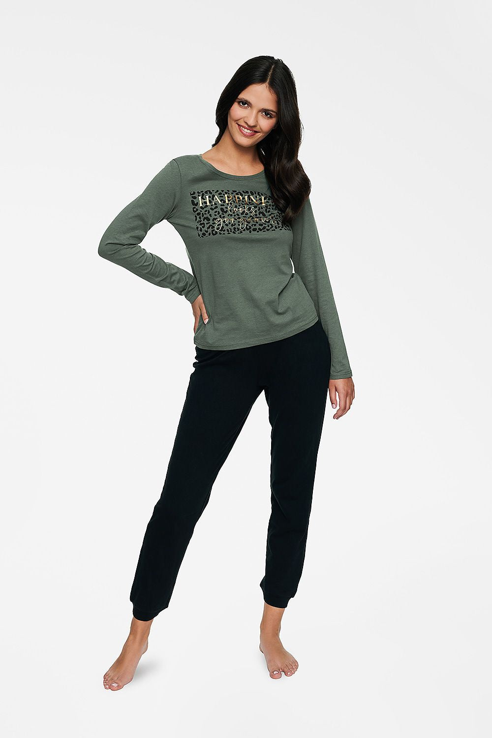 Henderson Women's Cotton Pyjamas Set featuring a luxurious long sleeve blouse in an elegant green hue and loose fit black pants, embodying comfort and style for evening relaxation.