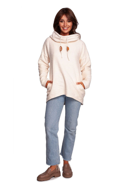BeWear Oversized Cotton Blend Hooded Sweatshirt Tunic for Comfortable Cold Weather, showcasing a stylish design, modelled by a woman in casual light blue jeans, exuding elegance and comfort.