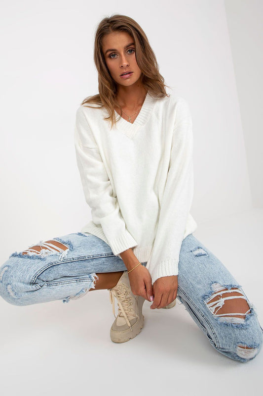 Elegant Women's Long Sleeve Sweater with Heart Neckline by Rue Paris, model in a chic pose wearing a white sweater featuring a heart neckline, ideal for versatile fashion statements.