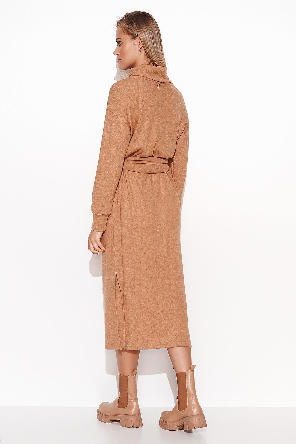 Elegant Long Fitted Ribbed Knit Dress With Turtleneck & Slit by Makadamia, showcasing the back view, highlighting the slit detail and luxurious ribbed knit fabric in a sophisticated camel colour.
