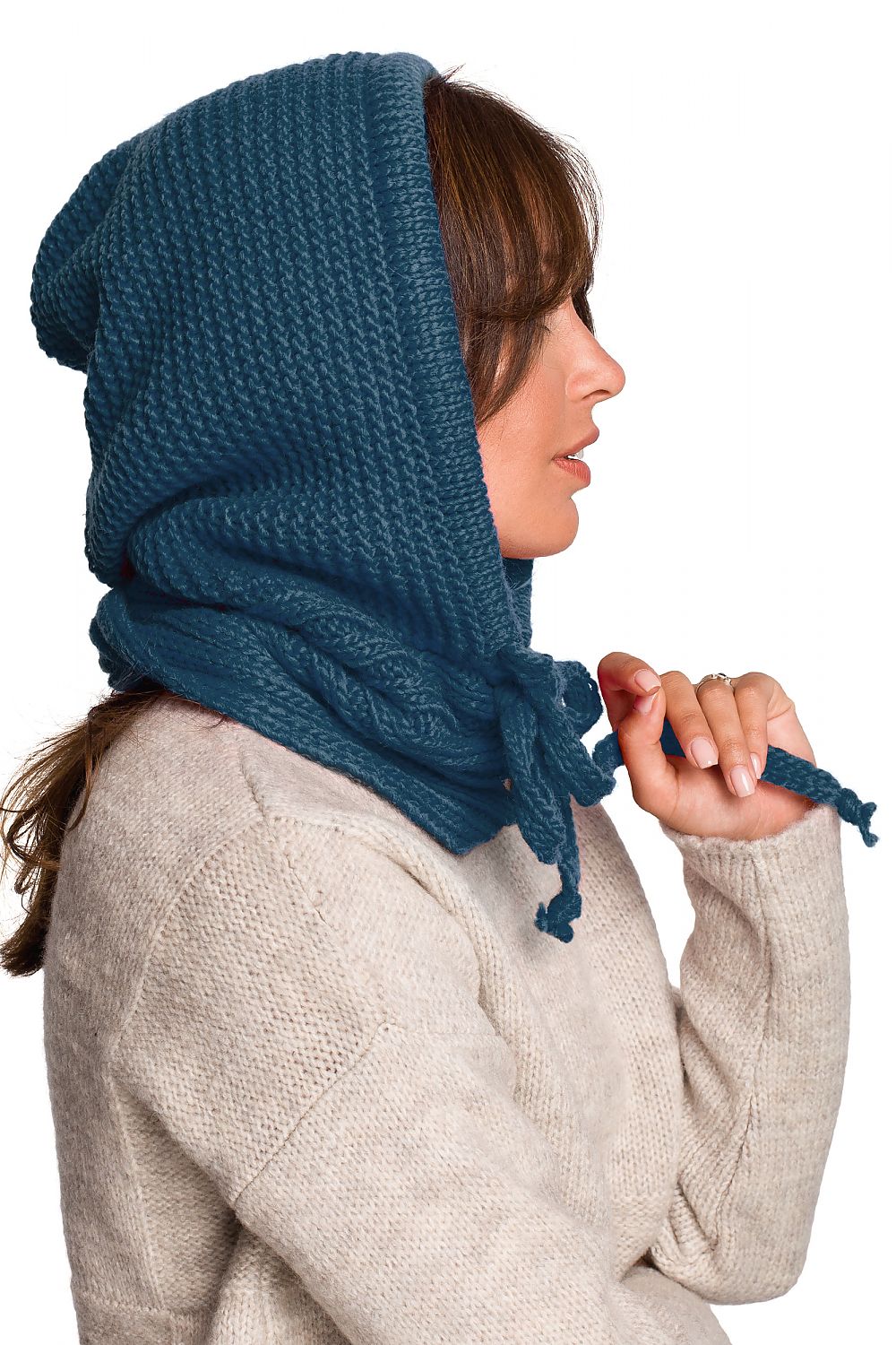 Side profile of a stylish woman wearing a rich teal infinity scarf, exhibiting a blend of acrylic, nylon, and wool, ideal for chic autumn styling.
