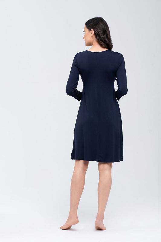 Back view of Babella luxury winter nightshirt, highlighting the smooth silhouette and comfortable fit. The navy nightgown features delicate lace detailing at the hem, perfect for a chic bedtime look.