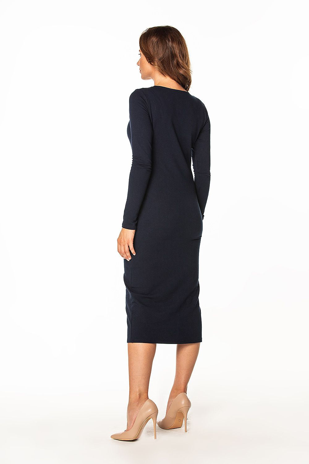Rear view of the exquisite long sleeve cotton dress by Tessita, featuring a flattering silhouette that accentuates elegance.