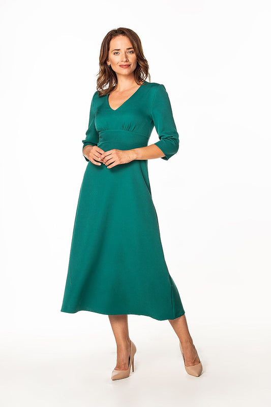 Sophisticated Tessita maxi dress in deep green with 3/4 sleeves, showcasing a flattering fit and covered zipper, suitable for elegant occasions.