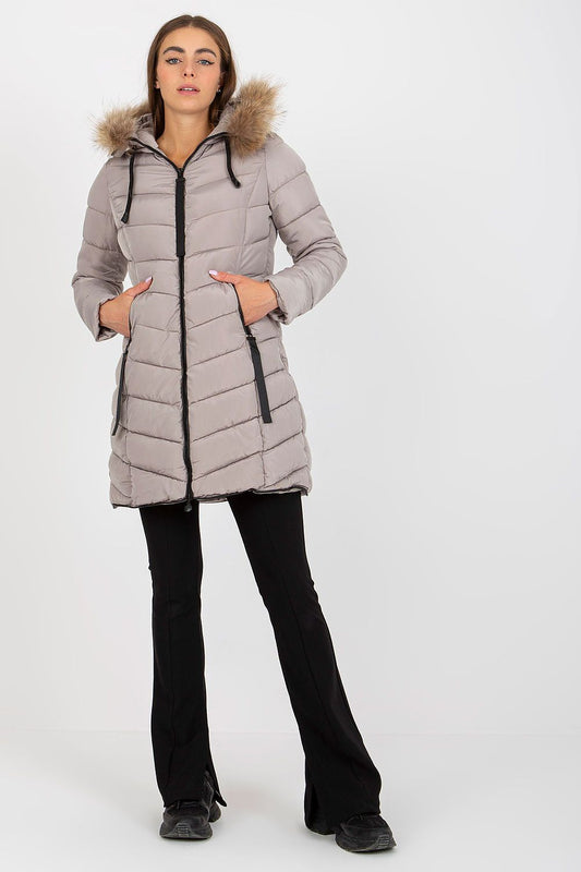 Chic NM polyester jacket designed for women, showcasing a sophisticated fur hood and a flattering fit, ideal for cold weather fashion.
