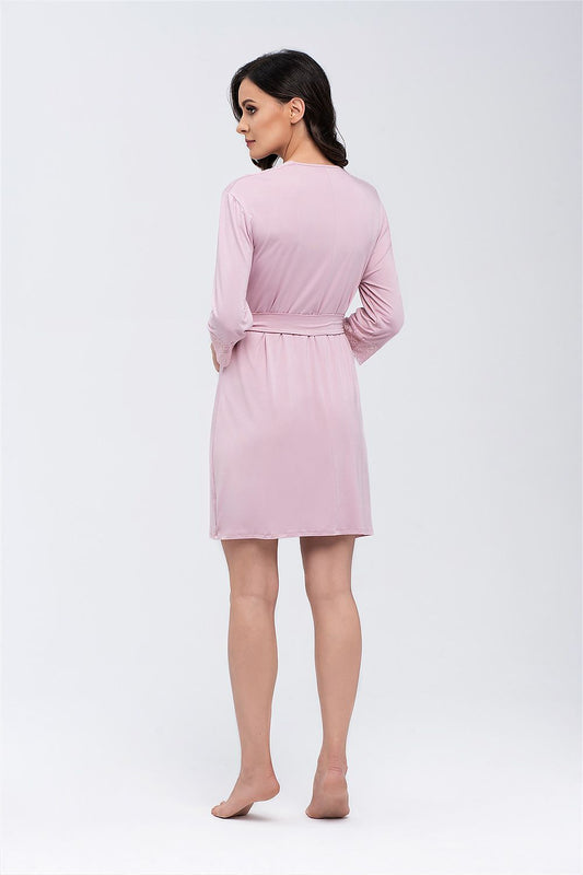 Back view of a luxurious pink lace bathrobe for women showcasing its elegant design with 3/4 sleeves and a soft, knee-length fit.