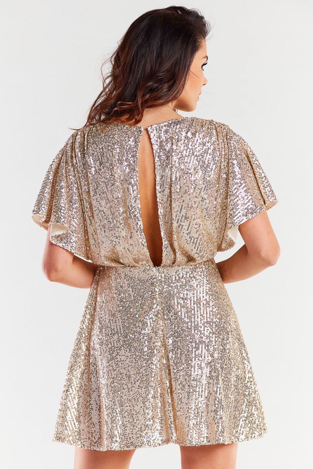 Chic back view of a gold sequin dress with a stylish open back design, highlighting exquisite craftsmanship and luxurious style.