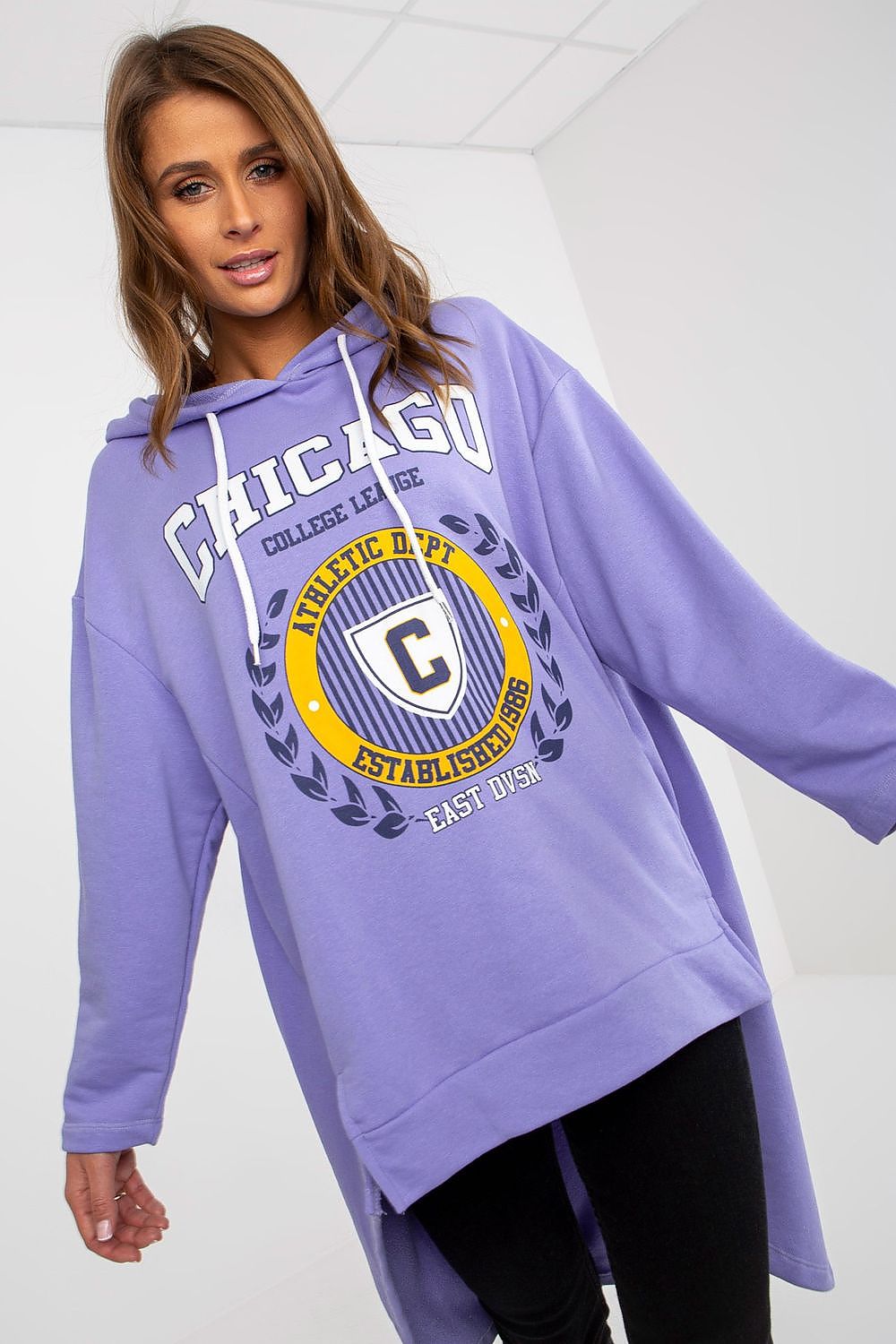 Close-up of a fashionable lavender hooded sweatshirt featuring a bold collegiate print, ideal for luxurious streetwear.