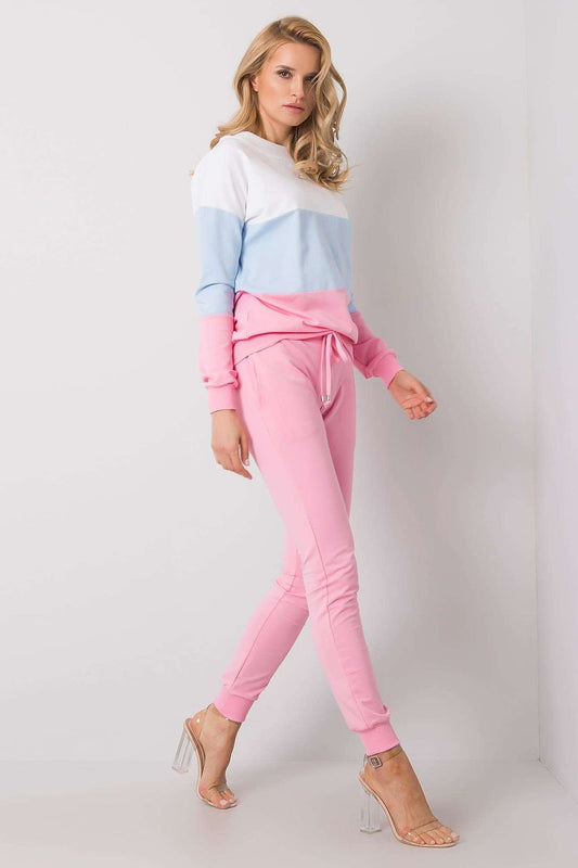 Chic model showcasing a luxury 2-piece cotton sweatshirt and jogger ensemble by Rue Paris, featuring a stylish colour-block design with pink and blue hues.