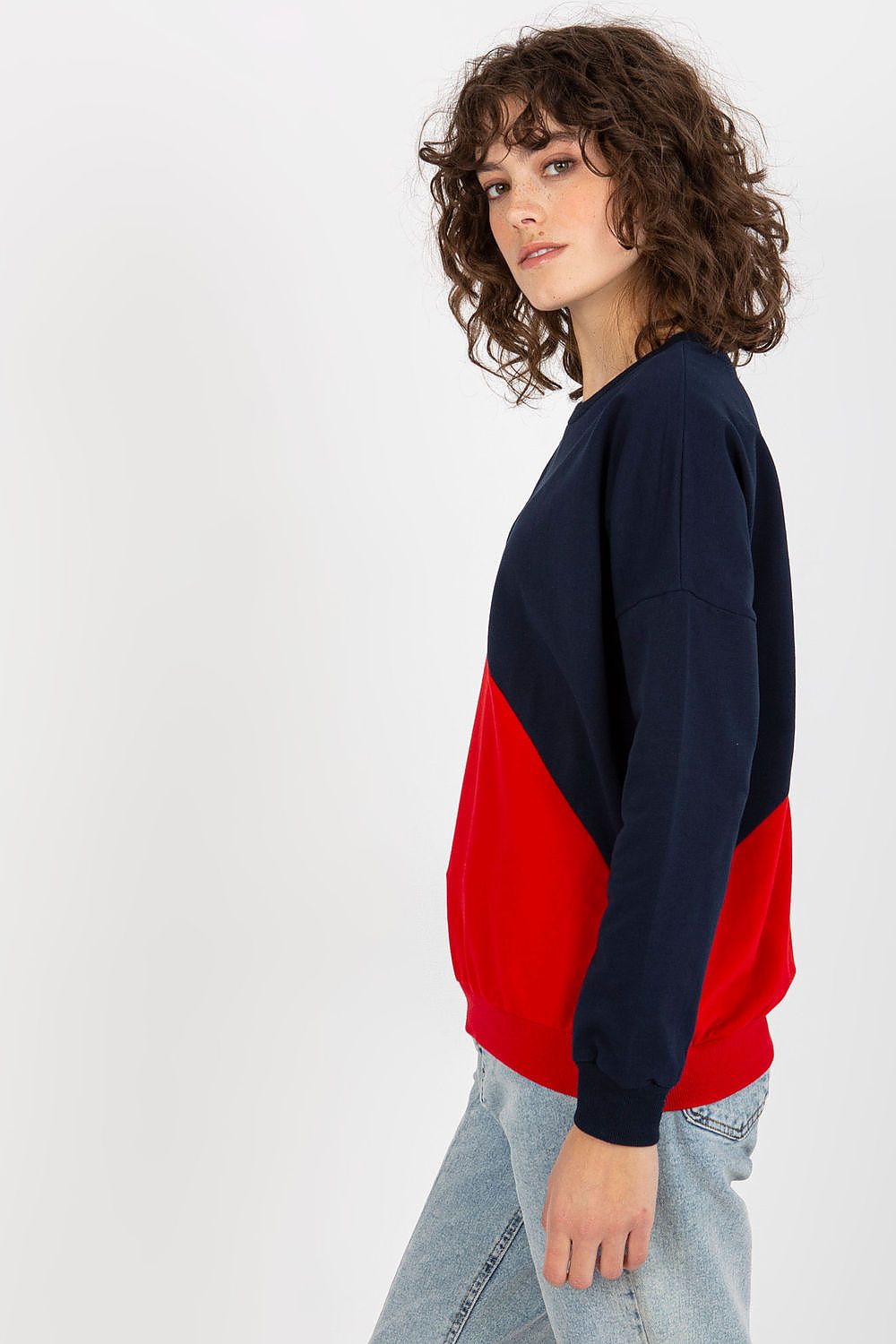 Stylish women's long sleeve cotton blend sweatshirt in navy blue and red with a chic geometric colour block design, capturing a relaxed luxury vibe.