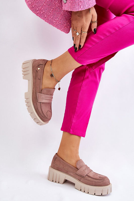 Sophisticated view of eco leather loafers with a chunky platform and rivet accents, paired with fashionable pink trousers, presented by Step in Style.