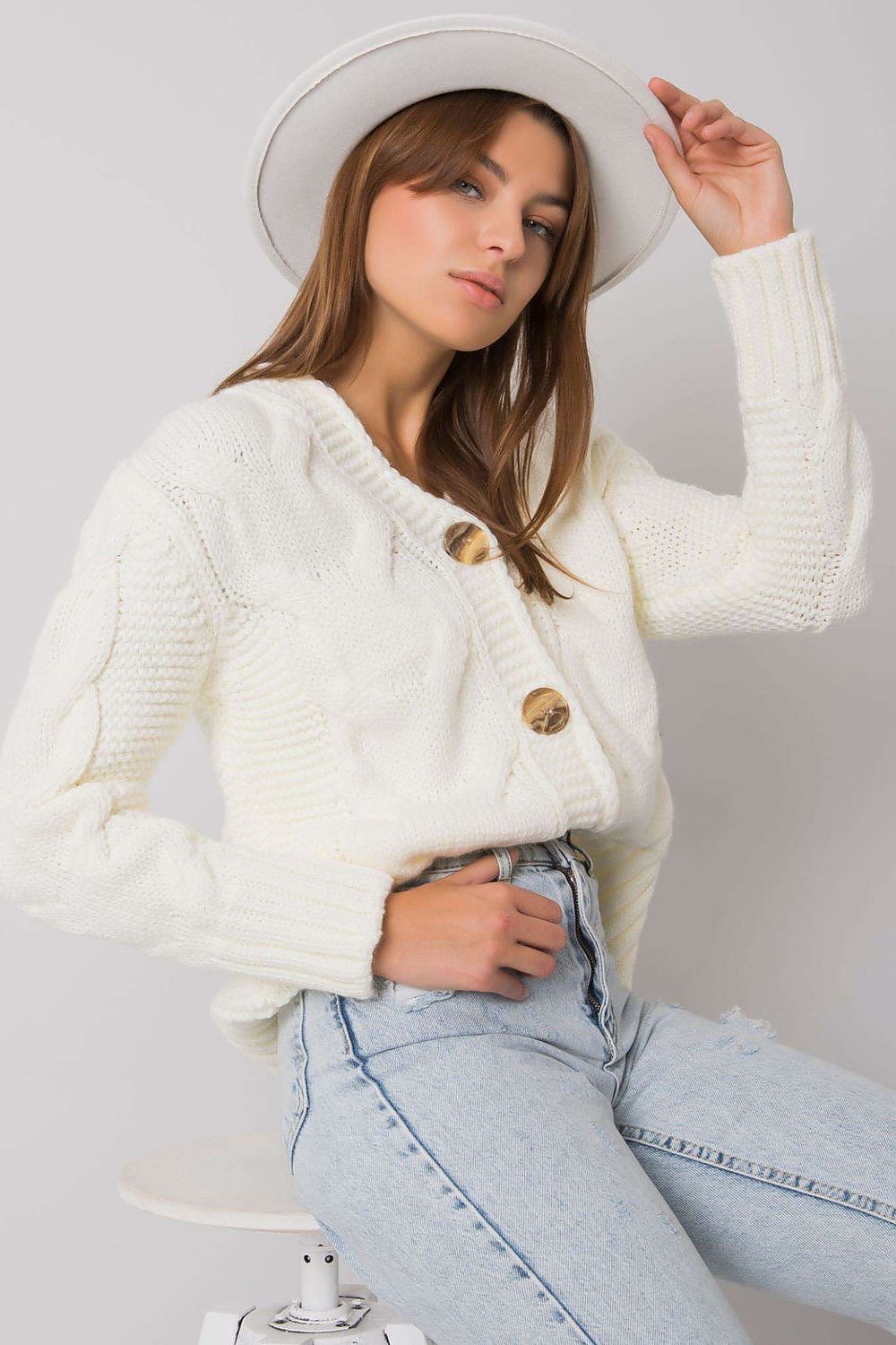 Model wearing the Luxurious Women's Cardigan by Rue Paris, highlighting its stylish silhouette and long sleeves.