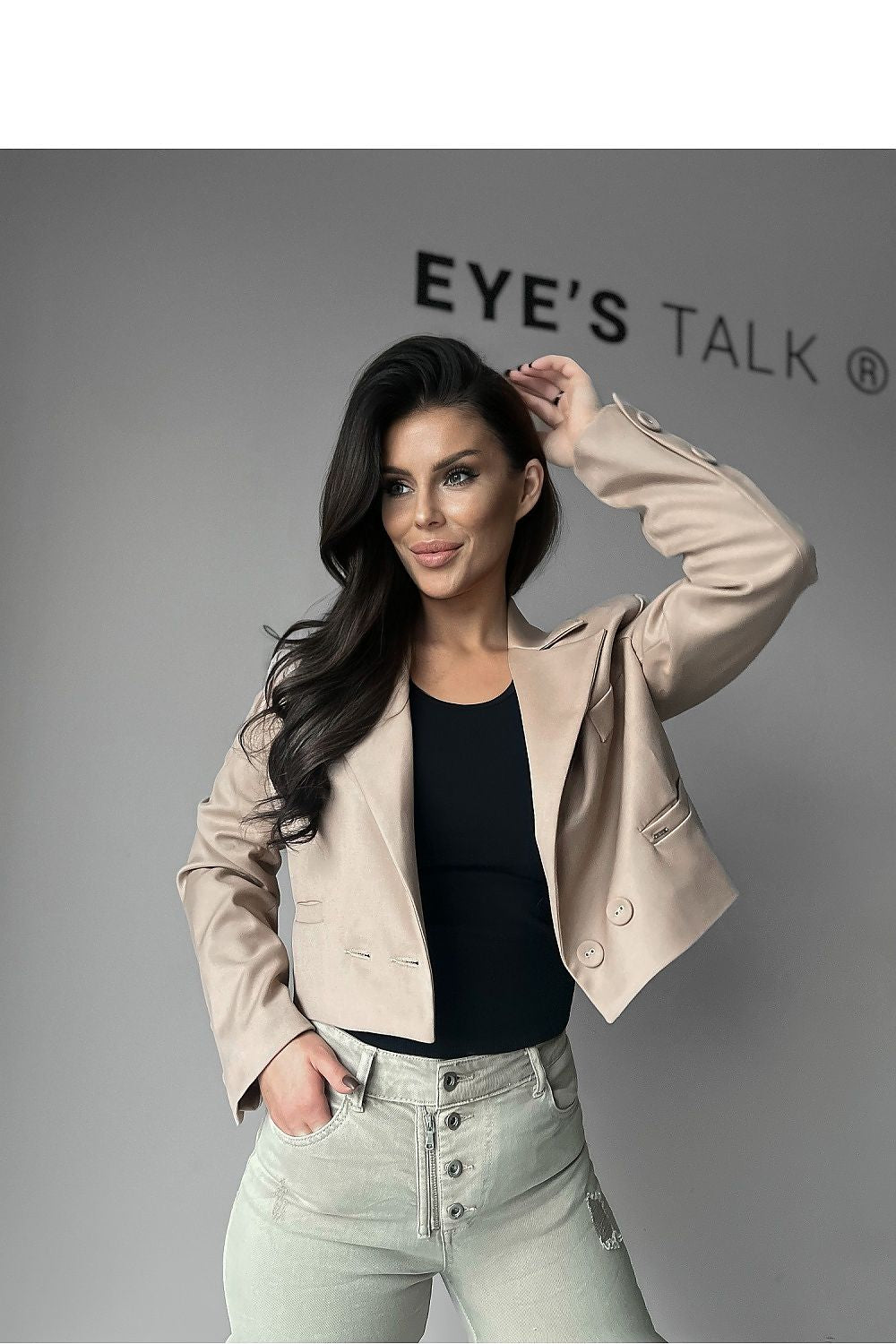 Stylish model wearing the O La La Luxury Short Jacket in Smooth Fabric with Long Sleeves and Button Closure, exemplifying contemporary luxury fashion.