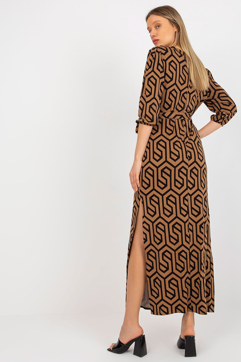 Elegant Lakerta long dress with heart neckline and 3/4 sleeves, featuring a stylish geometric pattern and side slits, perfect for sophisticated evening wear.