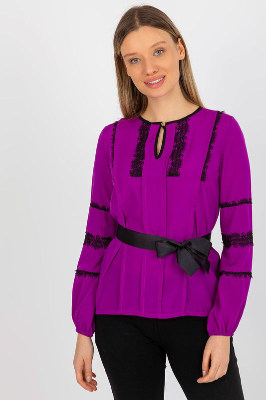 Elegant Lakerta long sleeve blouse in vibrant purple with intricate lace detailing and a stylish tie belt for a poised look.