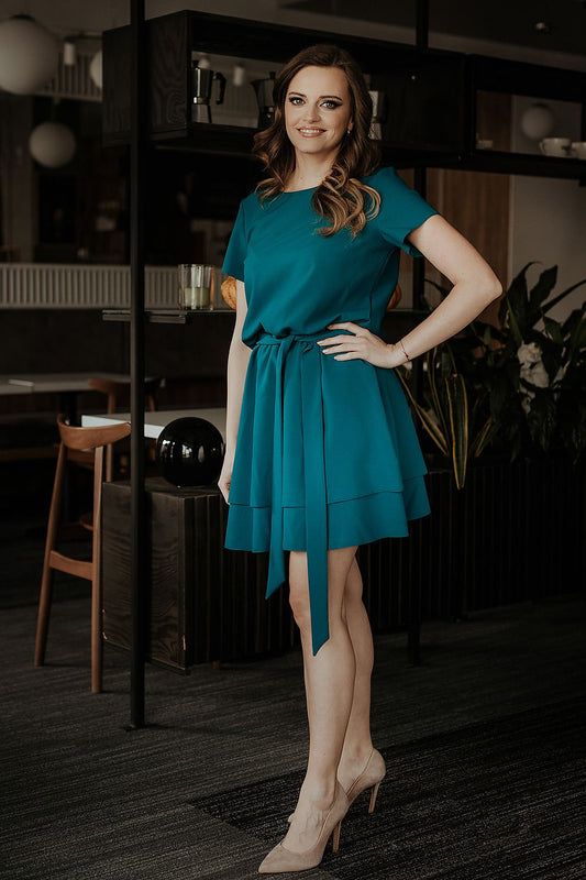 Elegant Tessita luxurious daydress featuring short sleeves and an elastic waistband, perfect for summer outings.