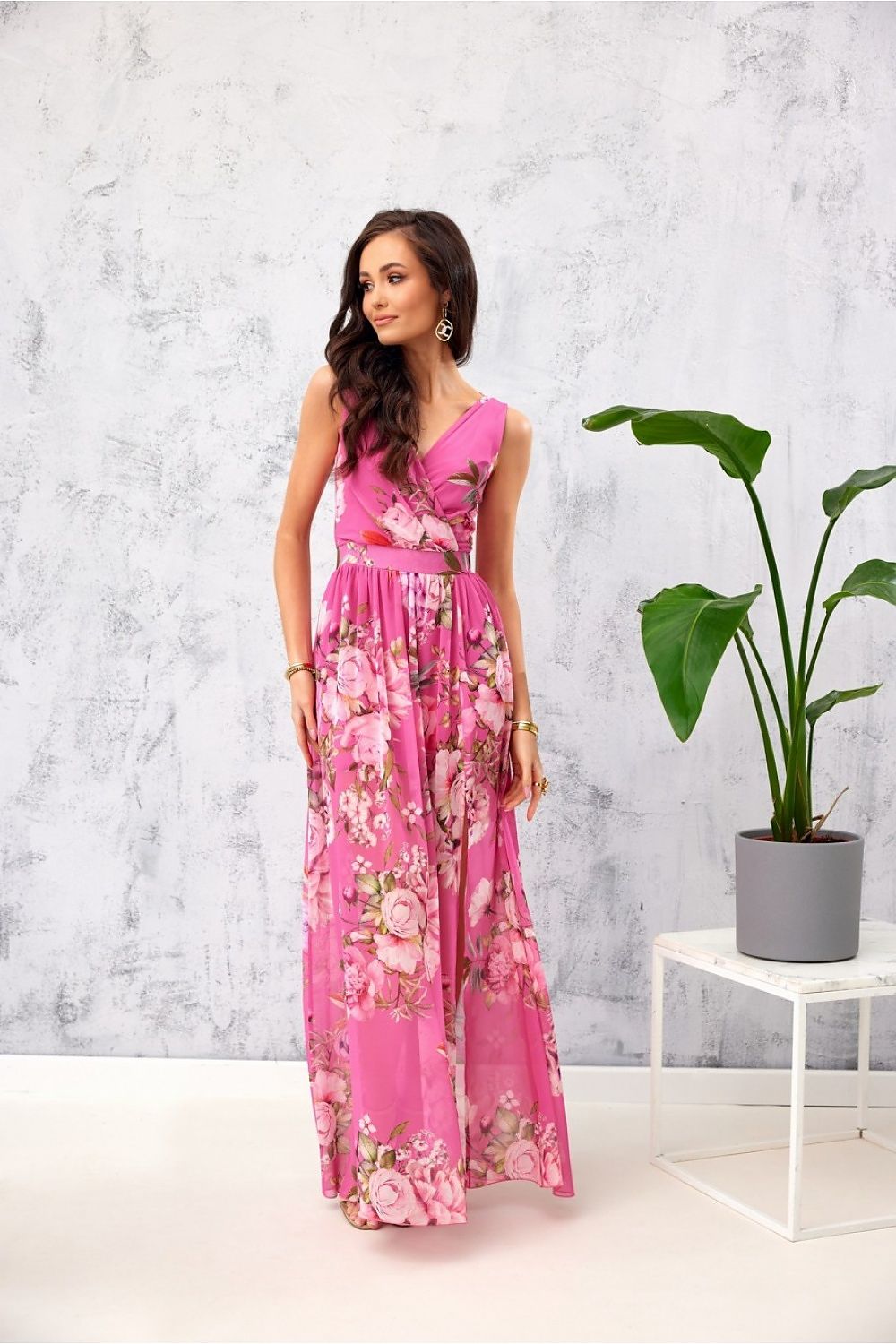 Graceful pink floral chiffon maxi dress by Roco Fashion, complete with a chic leg slit and an elegant envelope neckline, perfect for weddings and formal outings.