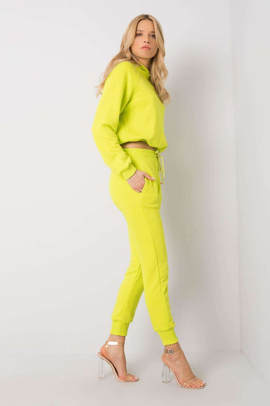 Side view of luxury BFG cotton spandex hoodie sweater and fitted pants set in striking neon yellow, illustrating the stylish design and comfortable fit on a model.