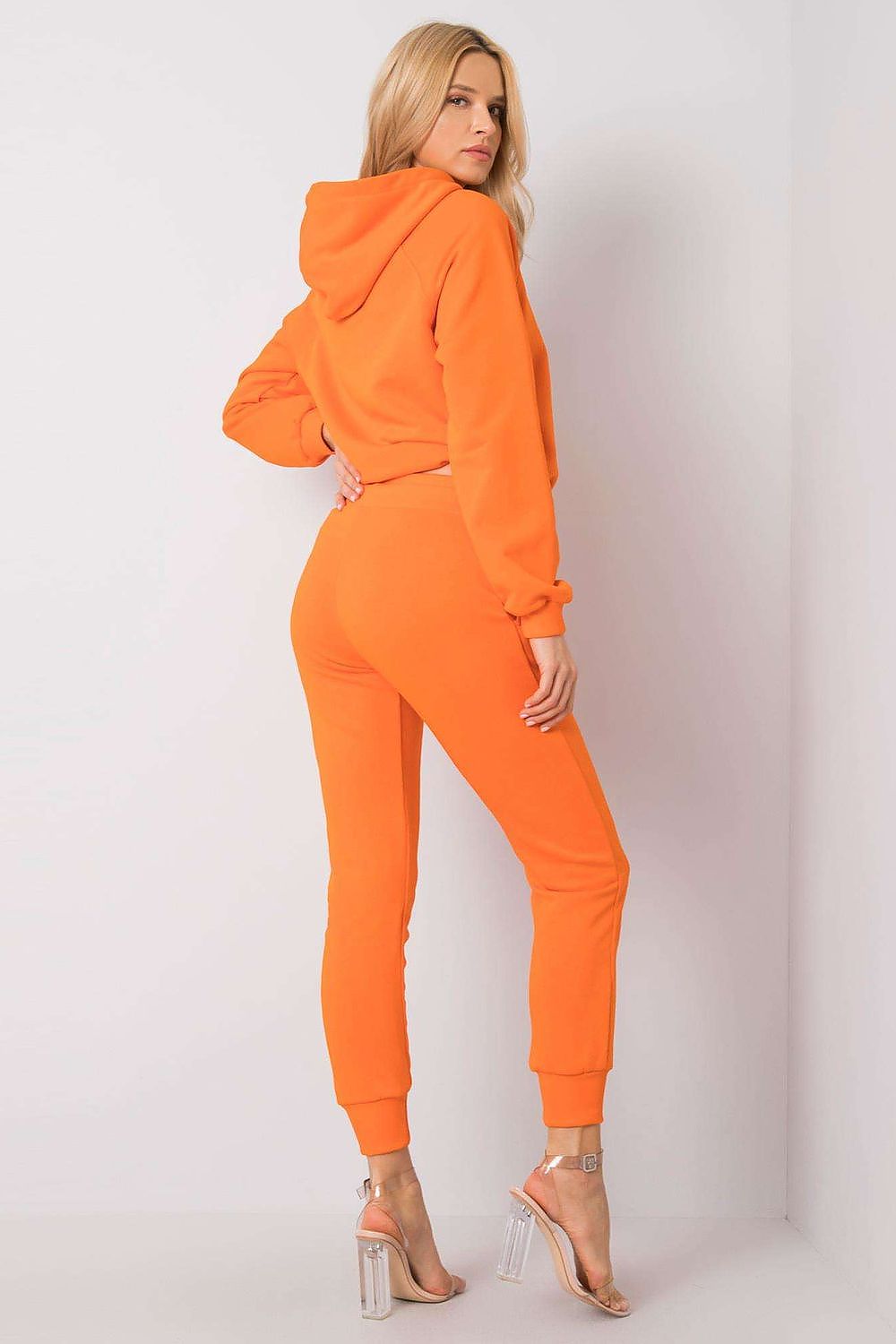 Back view of the Luxury BFG Cotton Spandex Hoodie Sweater and Fitted Pants Set in striking orange, highlighting the hooded design and flattering fit tailored for luxurious comfort.