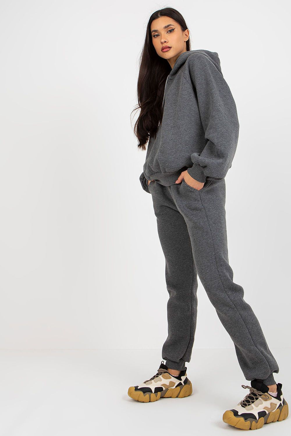 Stylish model confidently wearing the Ex Moda Premium Cotton-Blend Sweatshirt Set in grey, showcasing the fashionable hoodie and tapered pants for a luxe vibe.