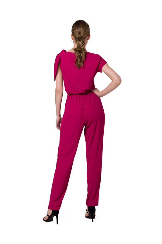 Chic back view of a fuchsia one-shoulder jumpsuit by Stylove, showcasing sleek tapered legs and an elastic waist, ideal for a stylish evening look.