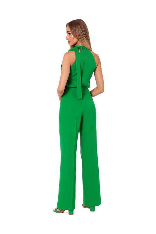 Back view of the elegant green halter neck pantsuit by Moe, showcasing the tasteful tie detail and flattering silhouette.
