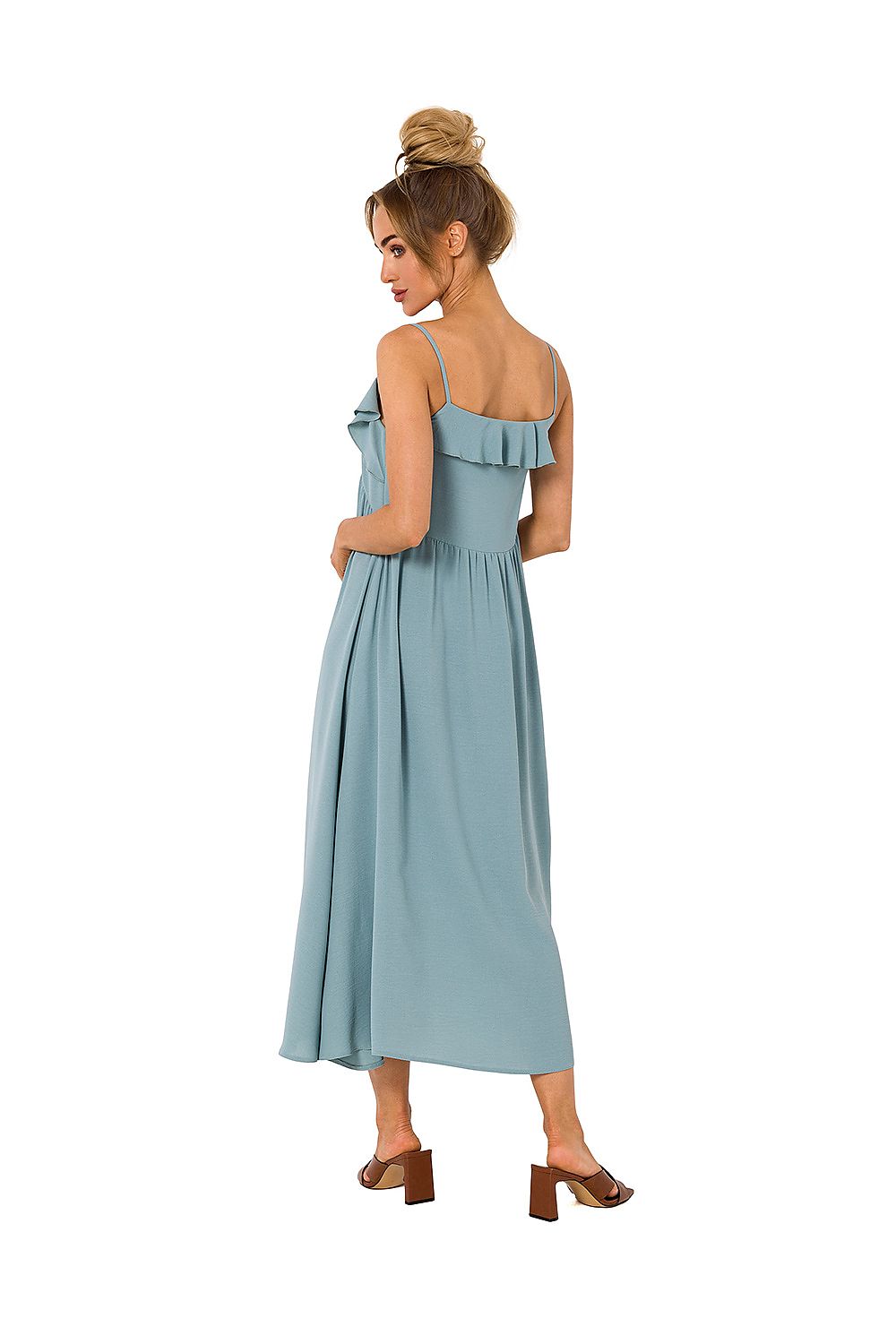 Sophisticated back view of Moe's loose-fitting midi dress in pastel blue, showcasing beautiful ruffled details and comfort for elegant occasions.