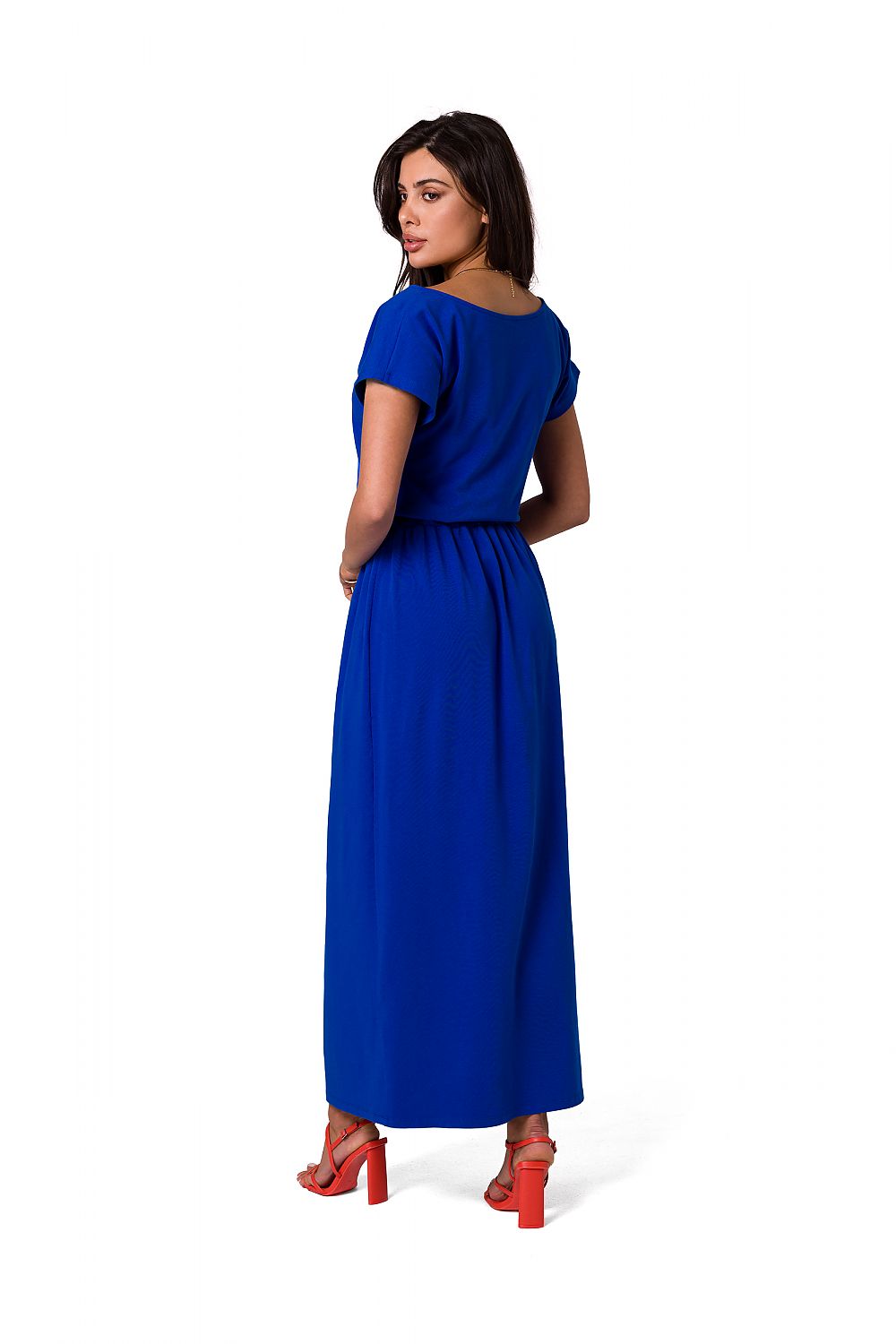 Sophisticated view of the BeWear cotton maxi dress in striking blue from behind, showcasing its graceful silhouette and elastic waistband, paired with stylish red shoes.