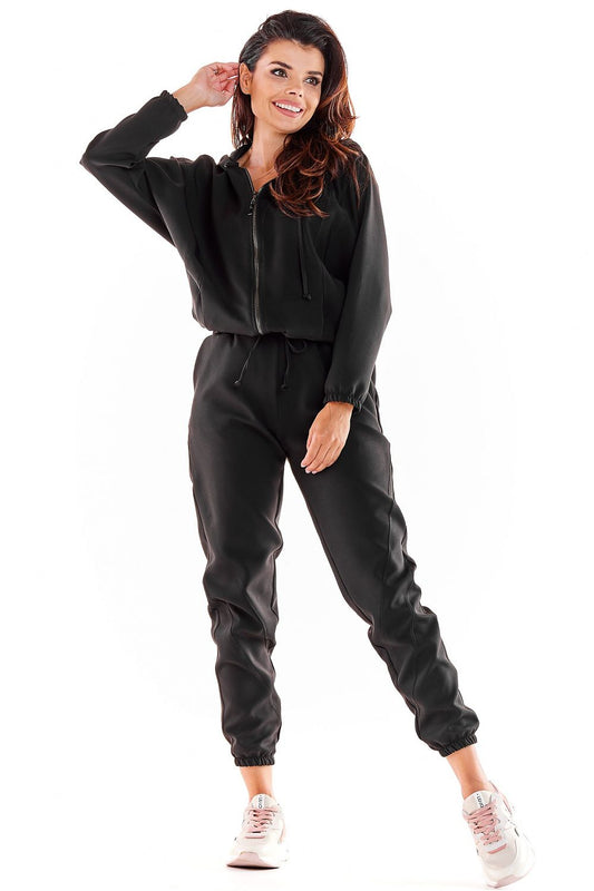 Elegant black Awama tracksuit with a loose silhouette and elasticated cuffs, perfect for a chic athleisure look.