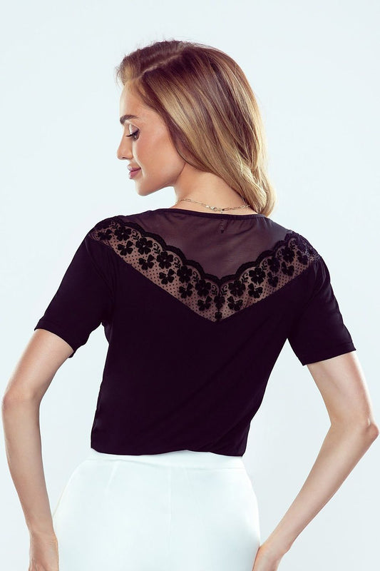 Elegant short-sleeve blouse by Eldar, showcasing a stunning transparent tulle and lace neckline. Captivating back view highlighting intricate lace detailing, designed for a chic and sophisticated look.