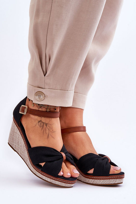 Elegant women's sandals by Step in Style featuring an 8cm heel, adjustable strap, and non-slip sole, styled with light-toned trousers and delicate ankle accessories.