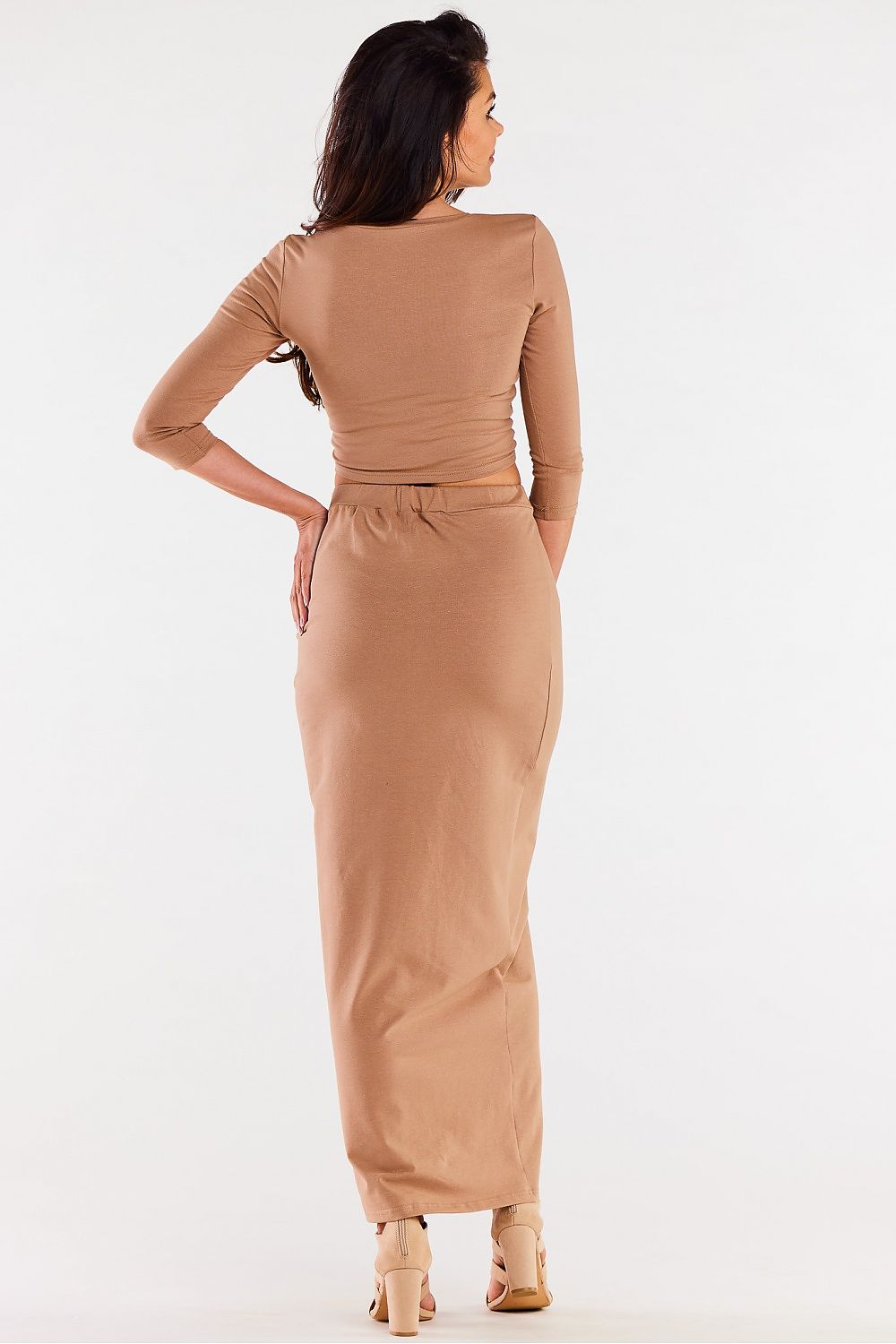 Elegant maxi skirt with slit designed by Infinite You, crafted from soft knit fabric for a flattering fit that accentuates the figure, showcasing luxury fashion for women.