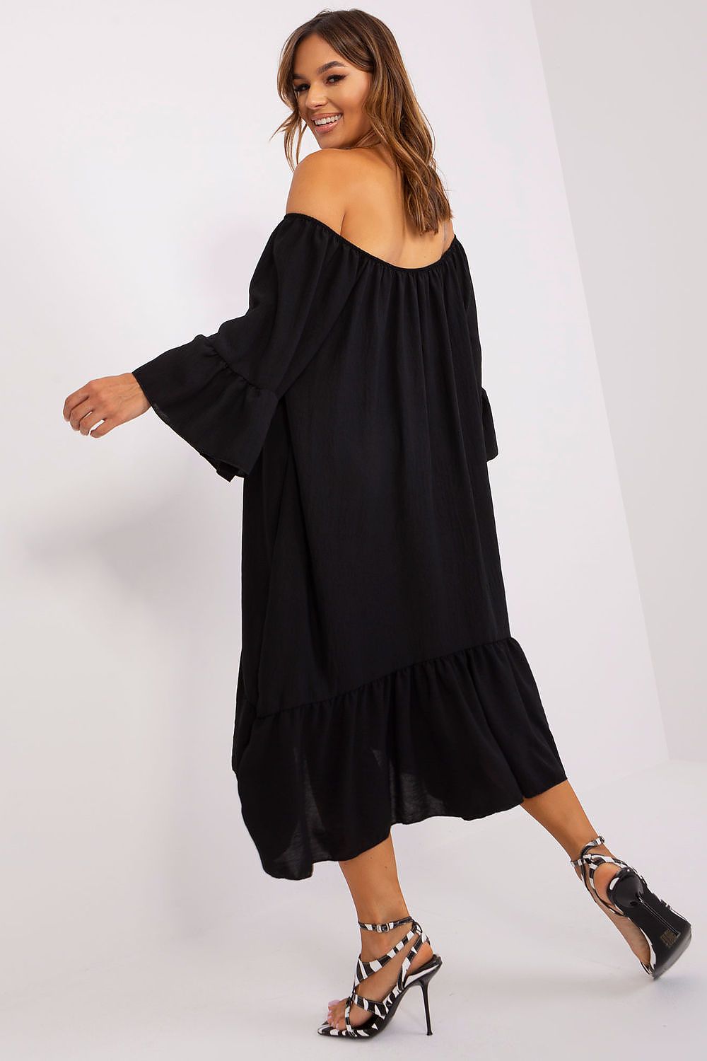 Chic summer dress with a loose fit and frill accents, featuring a round neckline and 3/4 sleeves, designed by Italy Moda for a luxurious summer wardrobe.
