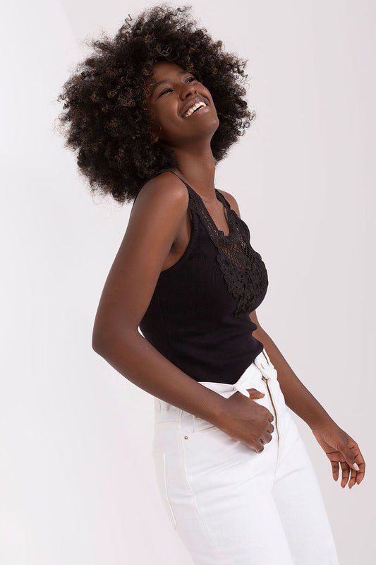 Close-up of the intricate lace detailing on the neckline of the Och Bella Ribbed Strapless T-shirt.