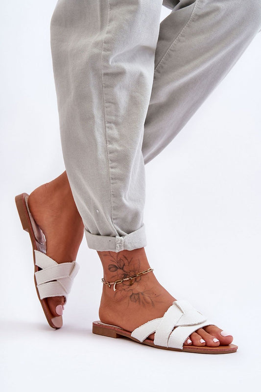 Elegant women's flat-heeled flip-flops with interlaced textile straps, perfect for summer wear by Step in Style.