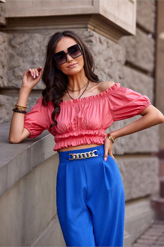 Elegant short blouse designed by Roco Fashion, featuring decorative ruffles and a chic Spanish cut.