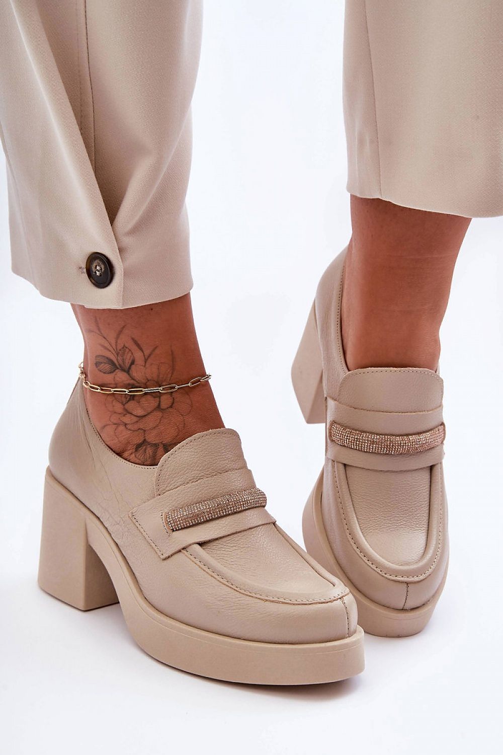 Step in Style luxury women's heeled half shoes with natural leather construction and a comfortable footbed, accented by a sophisticated wide heel for stability and style.