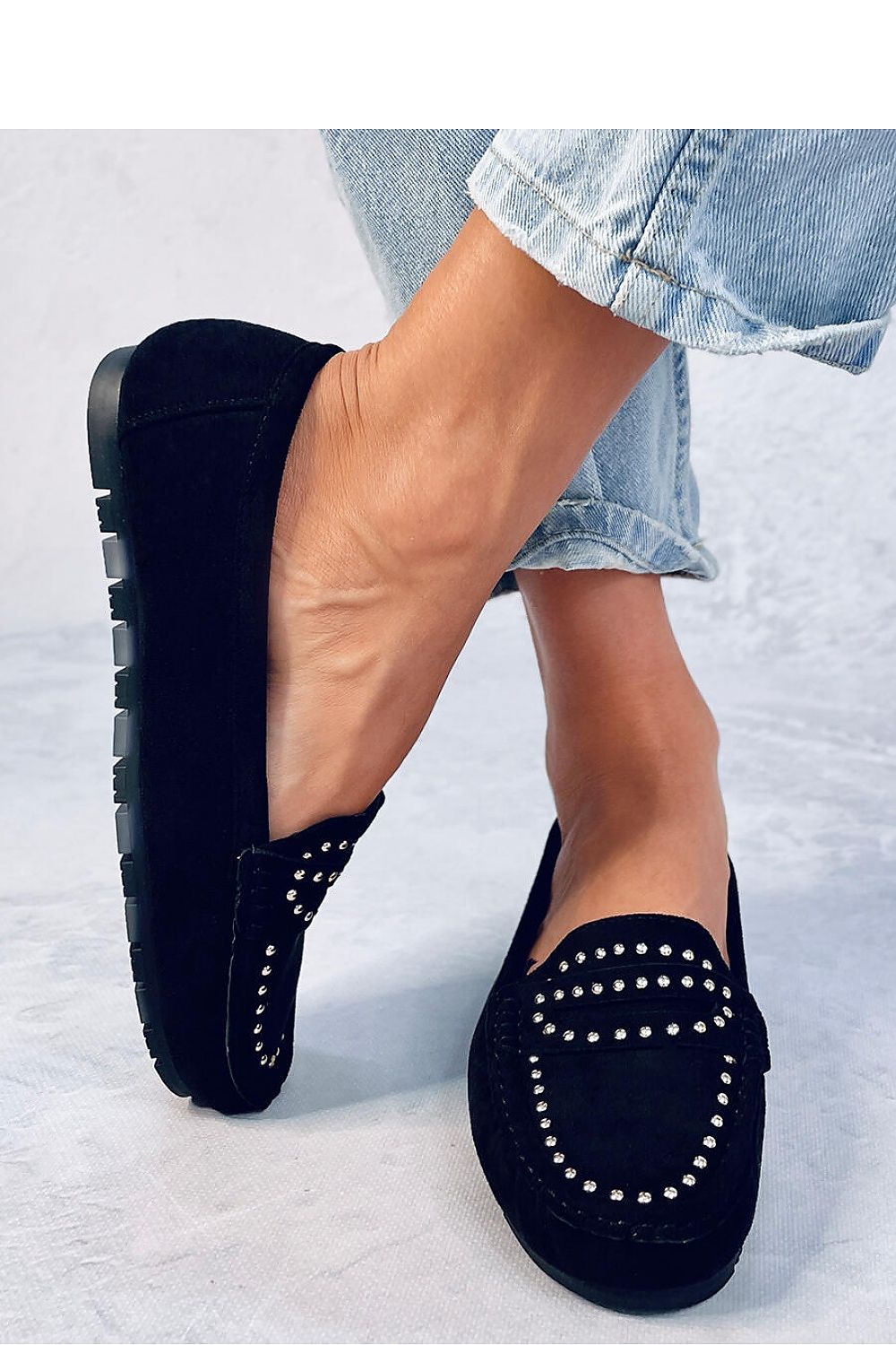 Close-up of Inello women's luxury moccasins made of soft ecological suede, showcasing a sophisticated studded design for ultimate comfort.