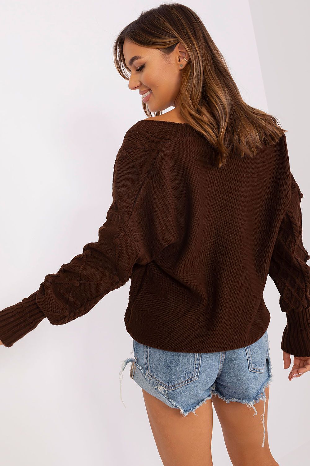 Full view of the Badu heart neckline cardigan sweater, highlighting its comfortable fit and stylish buff sleeves, perfect for both casual and work occasions.