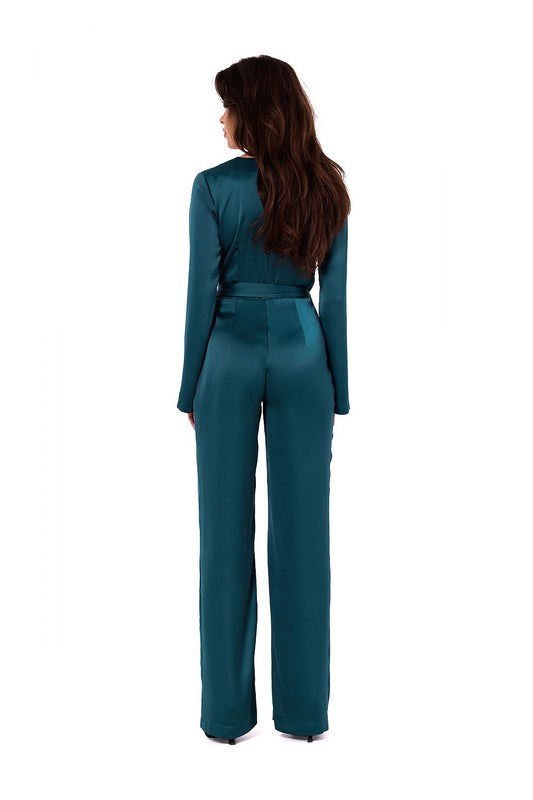 Close-up detail of Makover's luxurious satin jumpsuit, showcasing its tied belt and refined craftsmanship.