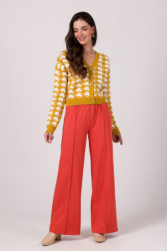 Close-up of the decorative buttons on the BE Knit Cardigan, highlighting the luxurious craftsmanship and unique style features.