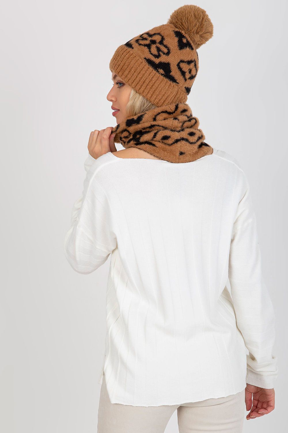 Fashionably draped infinity scarf made of 100% acrylic, showcasing a distinctive design that complements any elegant attire.