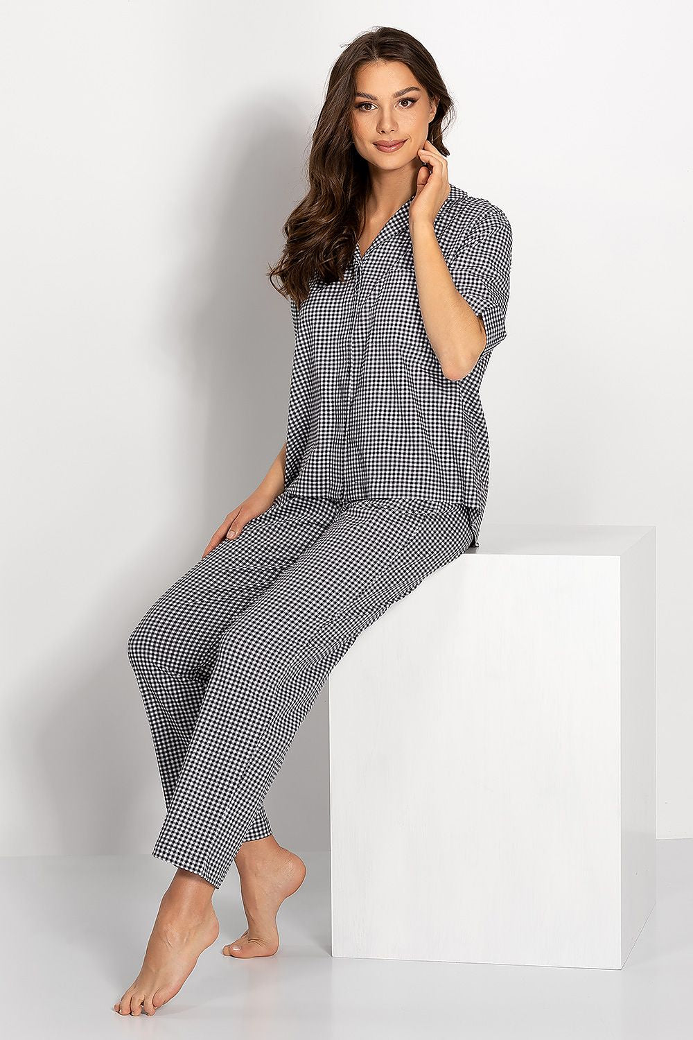 Chic women's cotton pajamas set with a sophisticated checkered design, including a button-down collar shirt and comfortable long pants.