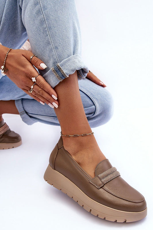 Sleek natural leather women's slip-on shoes featuring a chic design and cushioned footbed for all-day wear, ideal for sophisticated style.