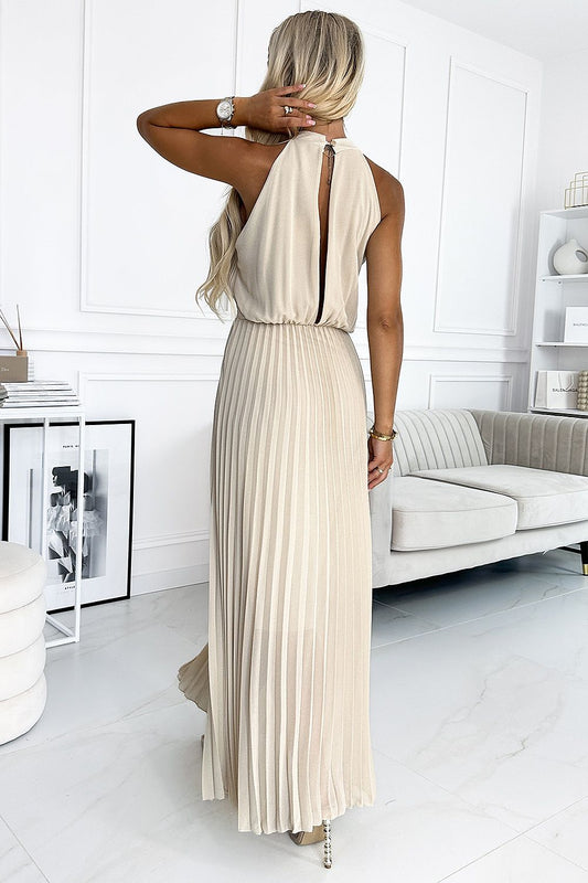 Exquisite back view of the Numoco beige pleated midi dress showcasing its deep neckline and luxurious chiffon fabric, ideal for stylish occasions.