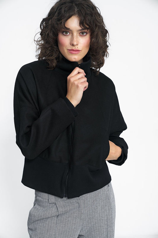 Close-up of the luxurious fabric details of the Nife Timeless Black Jacket, highlighting its premium polyester blend and sophisticated minimalist aesthetic perfect for elegant autumn looks.